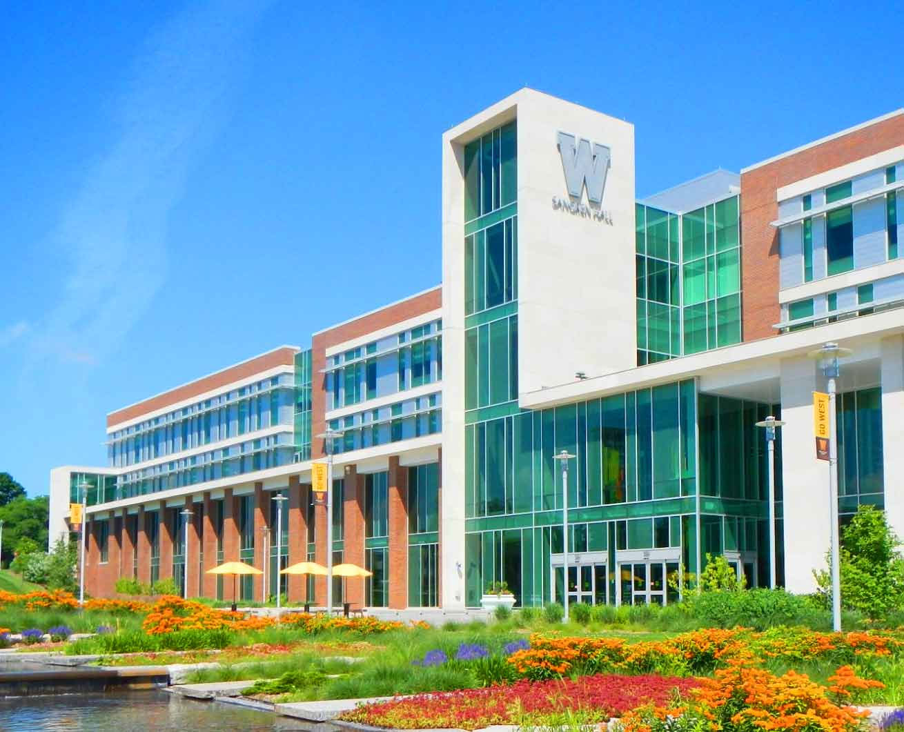 A large building with a fountain in front of it.