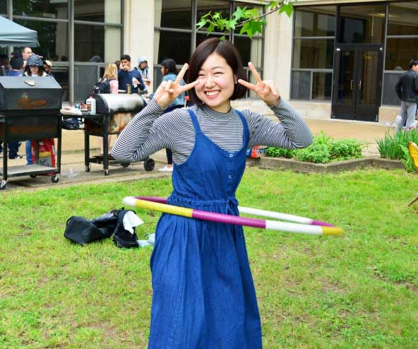 a young woman with a hula hoop