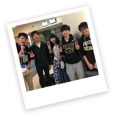 students smiling in hallway