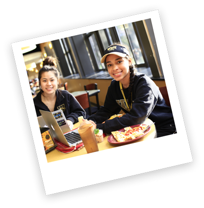 two people sitting at a restaurant